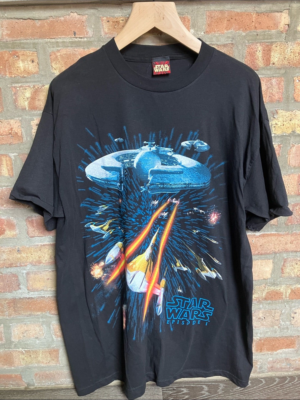 vintage Star Wars Episode I t-shirt features a space battle graphic.